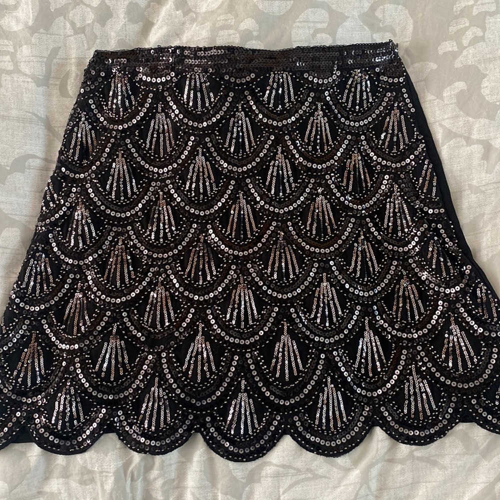 Sequin, scalloped front black mini skirt